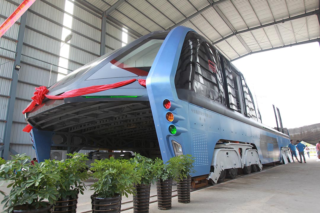 A model of an innovative street-straddling bus called Transit Elevated Bus is seen after a test run in Qinhuangdao, Hebei Province, China, August 3, 2016. The test bus currently consists of one segment, and is capable of carrying 300 people, according to local media. REUTERS/Stringer ATTENTION EDITORS - THIS IMAGE WAS PROVIDED BY A THIRD PARTY. EDITORIAL USE ONLY. CHINA OUT. NO COMMERCIAL OR EDITORIAL SALES IN CHINA.